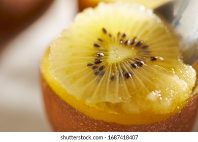 Eating Gold Kiwifruit With Spoon