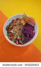 Eating Healthy Breakfast Bowl. Acai Breakfast Superfoods Smoothie Bowl With Chia Seeds, Bee Pollen, Fresh Strawberry, Apple, Almond And Granola For Healthy Vegan 