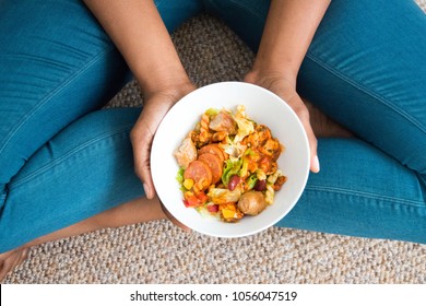 Eating Healthy Salad Bowl. Chicken Chorizo In White Ceramic Bowl In African American Woman's Hands. Clean Eating, Dieting, Detox, Vegetarian Food Weight Loss Diet Concept Kitchen And Cooking