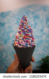 Eating An Ice Cream Cone In New York City With A Soft Serve Sprinkles Hand Held From A Charcoal Activated Cone As A Foodie