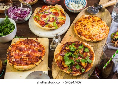 Eating Individual Pizzas From Pizza Bar.