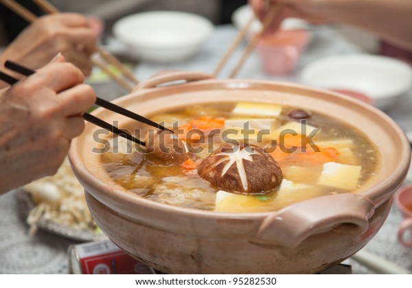 Eating Japanese winter\
hot soup - nabe