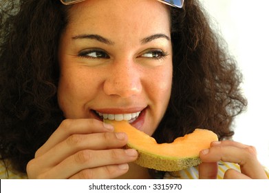 Eating A Juicy Cantaloupe With A Smile