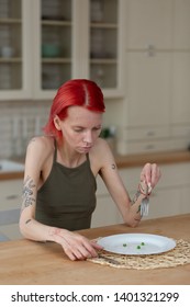 Eating Nothing. Red-haired Skinny Young Woman Suffering From Anorexia Eating Nothing