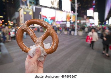 Eating Pretzel Fast Food In New York City.