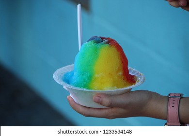 Eating A Rainbow-colored Bowl Of Hawaiian Shaved Ice In Waikiki, Oahu, Hawaii