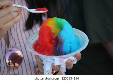 Eating A Rainbow-colored Bowl Of Hawaiian Shaved Ice In Waikiki, Oahu, Hawaii