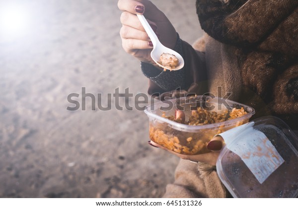 Eating rice food in outdoors from plastic box, close\
up view