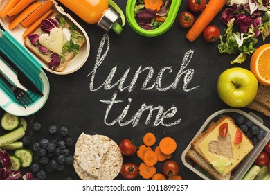 Eating right, storage and dieting conceptual background. Assortment of healthy food in plastic containers on black chalk board with lunch time inscription and copy space, top view - Shutterstock ID 1011899257
