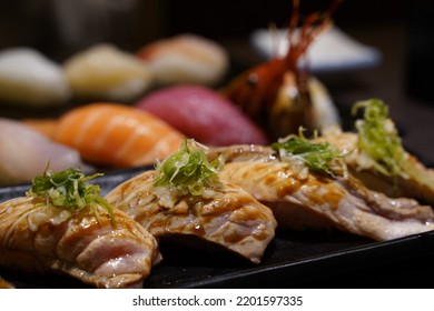 Eating Sashimi Seared Salmon Aburi Sushi At An Izakaya