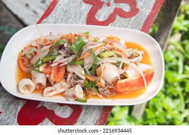 Eating Spicy Squid Salad On The Beach