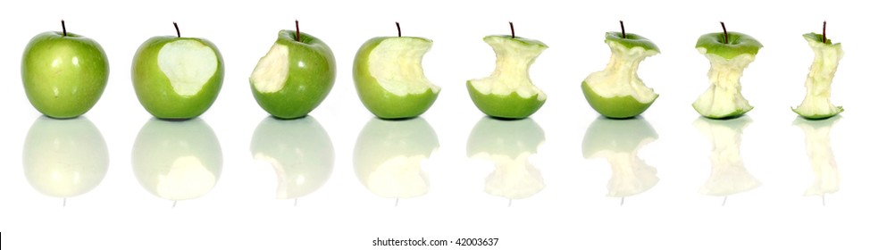 eating a tasty green apple isolated on white