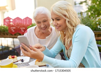 Eating, Technology And People Concept - Happy Smiling Young Daughter And Senior Mother With Smartphone At Cafe Or Restaurant Terrace Over Food Nutritional Value Chart