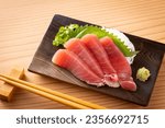 Eating tuna sashimi at a Japanese izakaya