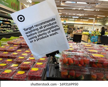 Eau Claire, Wisconsin - March 30, 2020: Sign At Target Stores In The Produce Section Recommends Washing Fruits And Vegetables Before Consuming