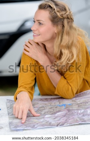 Similar – Image, Stock Photo Young women looking road map with 4×4 on background