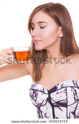 eautiful young woman with cup of tea on white background
