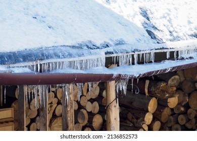 Eaves Weighed Down With Ice In Winter.