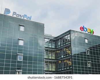 eBay American multinational e-commerce corporation and PayPal American company operating online payments system logo at the companies office building located in Potsdam, Germany - February 18, 2020