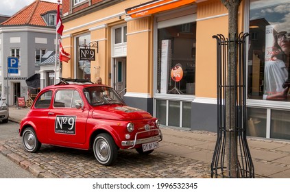 Ebeltoft, Denmark - 20 July 2020: Old red fiat, fiat 126, old car used as business advertisement