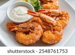 Ebi Fry: Breaded and deep-fried shrimp, often served with tartar sauce, prized for its crispy coating and juicy, tender interior.