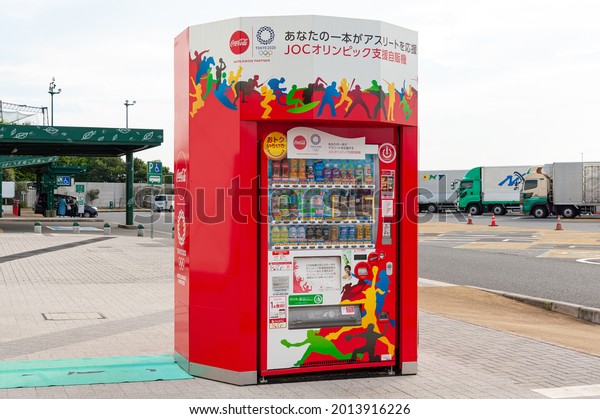 Ebina Service Area, Kanagawa Prefecture,\
Japan - July 10, 2021: Coca Cola drink vending machine with Tokyo\
2020 Olympic Games design. Front view.\
Close-up.
