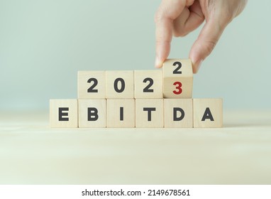 EBITDA in 2023 - Earnings Before Interest, Taxes, Depreciation and Amortization. Business, financial, money investment profit concept on wooden cubes. Bussiness goals, plan and achievement in 2023. 
