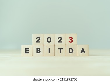 EBITDA in 2023 - Earnings Before Interest, Taxes, Depreciation and Amortization. Business, financial, money investment profit concept on wooden cubes. Bussiness goals, plan and achievement in 2023.  - Shutterstock ID 2151992703