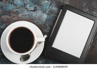 E-book and paper books on the table with a cup of coffee, a laptop and reading glasses. Concepts of self-education. - Shutterstock ID 1149848939