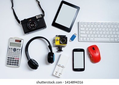E-book reader with cell phones, camera, keyboard, mouse and flash drives USB. on white background, Used modern gadgets or electronic equipment for daily use concept, Top view. - Shutterstock ID 1414894316
