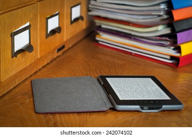 Ebook Reader In Library Stock Photo