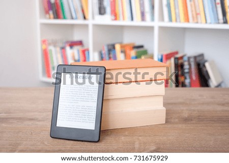 E-book reader on a stack of books