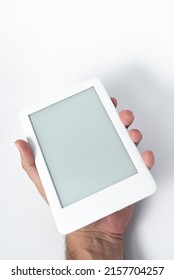 Ebook reader over isolated white background - being held by a male hand