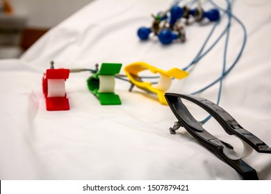 ECG Or EKG Electrodes For Electrocardiogram Records Patient Heartbeats On Bed In Hospital.