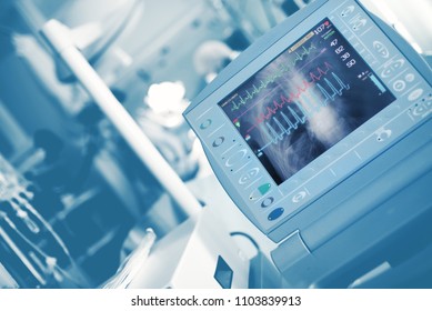 ECG Waves And Roentgen Image Of Chest On The Life Support Monitor During Medical Doctors Save The Patient In The ER.