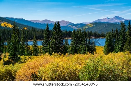 Echo Lake showing off her fall colors as seasons change and autumn colors come out in the Colorado Rocky Mountains near Mount Evans outside of Denver Colorado USA 