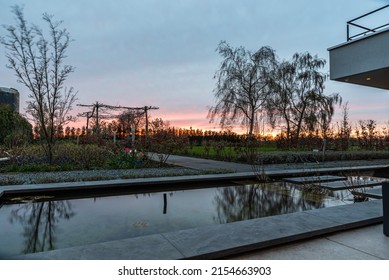 Echt, Limburg, The Netherlands, 04 09 2022 - Reflecting Trees In The Fountain Of A Contemporary Backyard