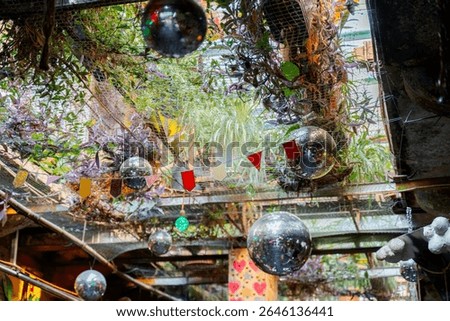 Eclectic Ceiling Decor with Disco Balls and Hanging Plants in Szimpla Kert Ruin Bar, Budapest: Budapest, Hungary 20.06.2025