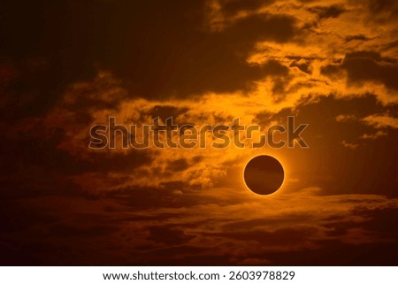 eclipse on the gold sunset sky and transparent cloud