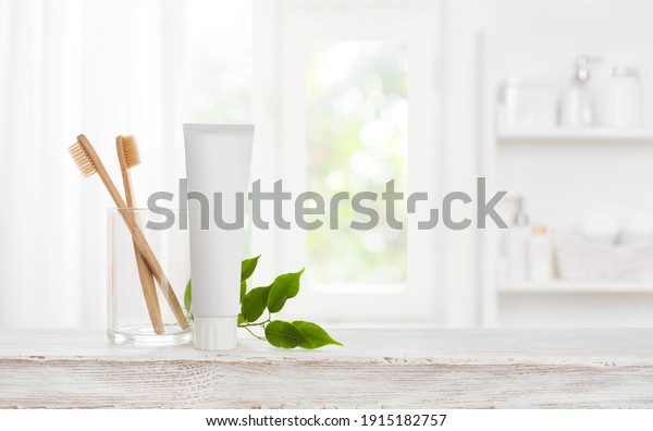 Eco bamboo toothbrushes and toothpaste tube mockup\
with copy space