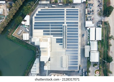 Eco building or factory in aerial view consist of solar or photovoltaic cell in panel on top of roof. Technology to generate electrical power, direct current electricity by light. Energy for future.