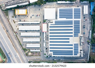 Eco Building Or Supermarket In Aerial View Consist Of Solar Or Photovoltaic Cell In Panel On Top Of Roof. Technology To Generate Electrical Power, Direct Current Electricity By Light For Future.
