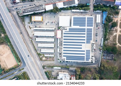 Eco Building Or Supermarket In Aerial View Consist Of Solar Or Photovoltaic Cell In Panel On Top Of Roof. Technology To Generate Electrical Power, Direct Current Electricity By Light For Future.
