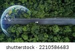 Eco car on forest road with earth planet going through forest, Ecosystem ecology healthy environment road trip travel, Eco car with nature, Electric car and earth EV electrical energy for environment.