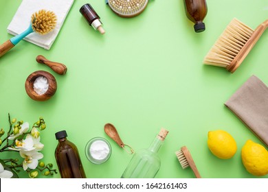 Eco Cleaning Household Background. Cleaning Products Homemade Safe Non Toxic Flat Lay, Baking Soda, Lemon Vinegar And Fresh Spring Blossoms On Green Color Background,