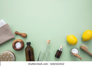 Eco Cleaning Household Background. Cleaning Products Homemade Safe Non Toxic Flat Lay, Baking Soda, Lemon Vinegar And Fresh Blossoms On Green Color Background,