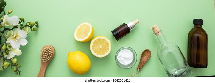 Eco Cleaning Household Background. Cleaning Products Homemade Safe Non Toxic Flat Lay, Baking Soda, Lemon Vinegar And Fresh Spring Blossoms On Green Color Background,