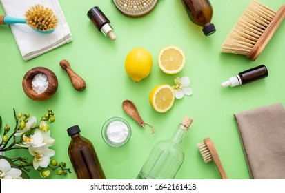 Eco Cleaning Household Background. Cleaning Products Homemade Safe Non Toxic Flat Lay, Baking Soda, Lemon Vinegar And Fresh Spring Blossoms On Green Color Background,