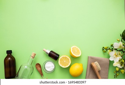 Eco Cleaning Household Background. Cleaning Products Homemade Safe Non Toxic Flat Lay, Baking Soda, Lemon Vinegar And Fresh Spring Blossoms On Green Color Background,