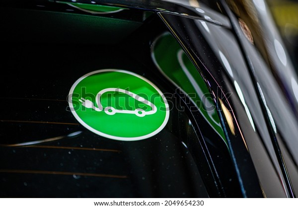 Eco electric car sign on the car, emission-free
vehicle designation,
closeup
